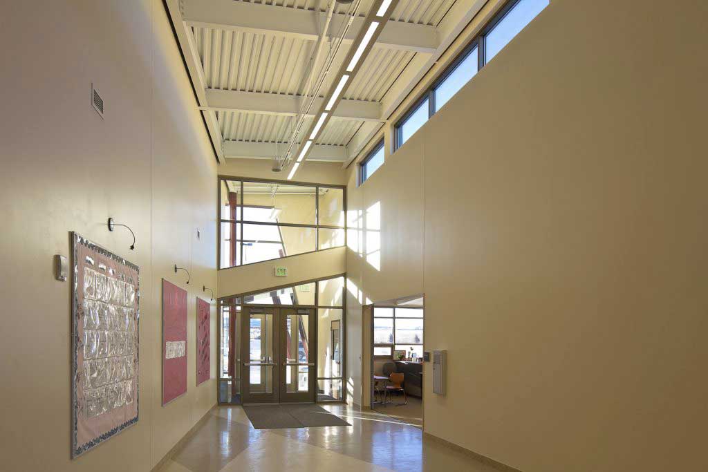 Secured vestibule with a single door that passes from a locked vestibule directly into the administrative space for processing of visitors.
